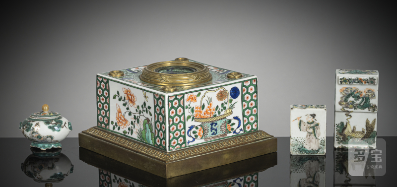 A group of four 'Famille verte' porcelains: Samson inkwell with bronze mount, two brush rests and a lidded box